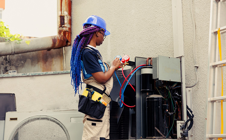 HVAC technician servicing equipment